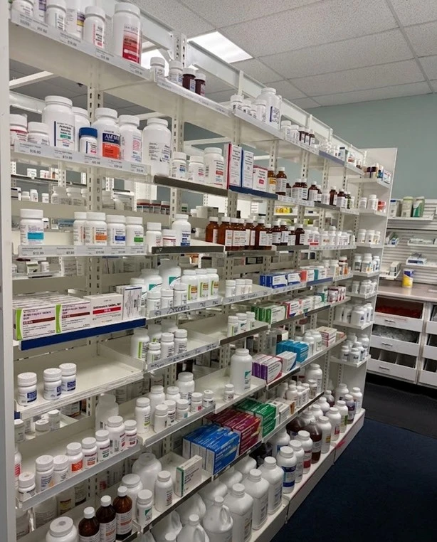 Pharmacy interior with stocked medication shelves